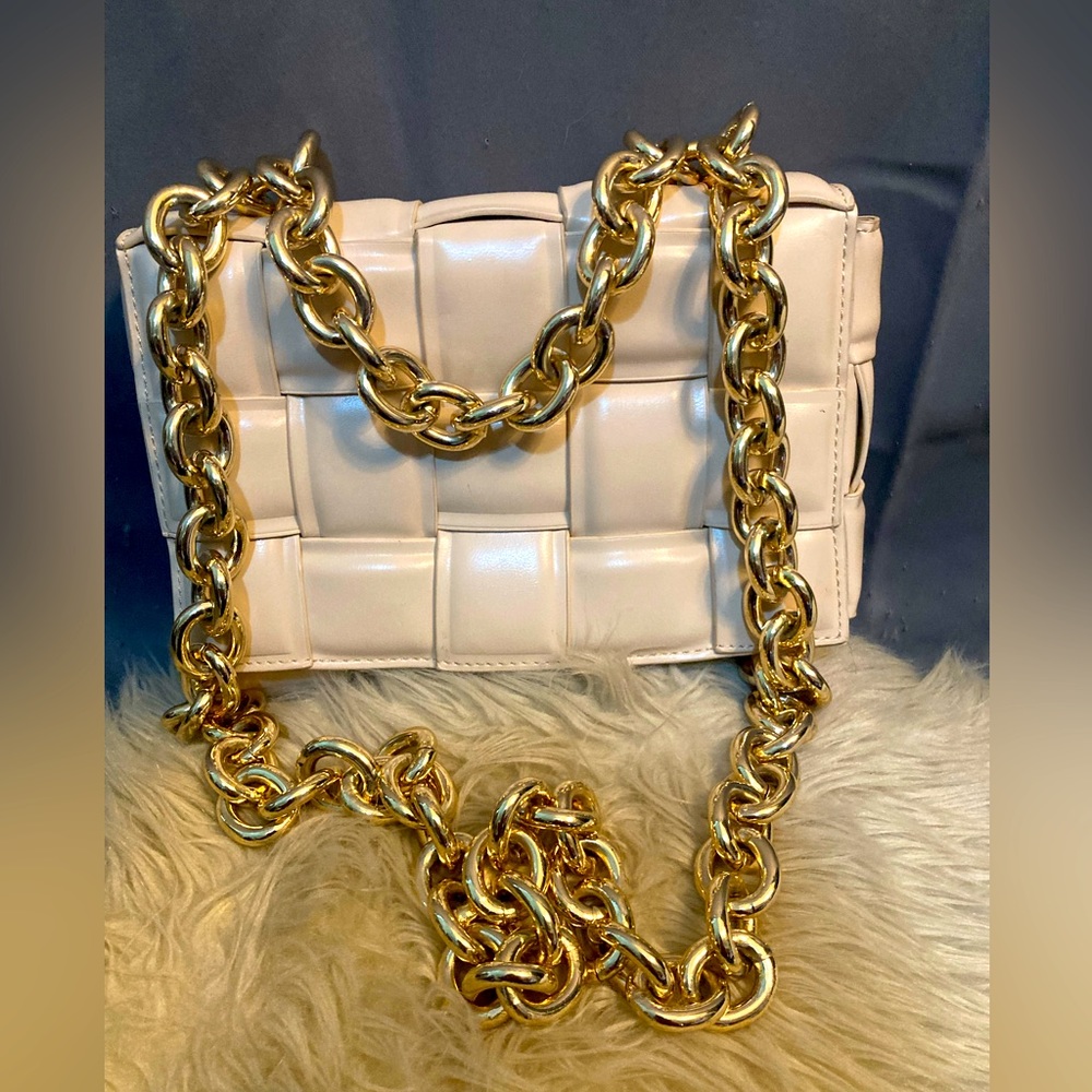 brand new purse cream color the material leather.